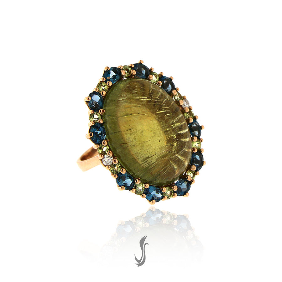anello con tormalina, diamanti, topazi london, peridoti e oro