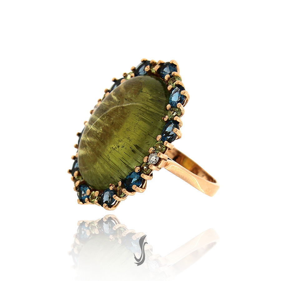 anello con tormalina, diamanti, topazi london, peridoti e oro