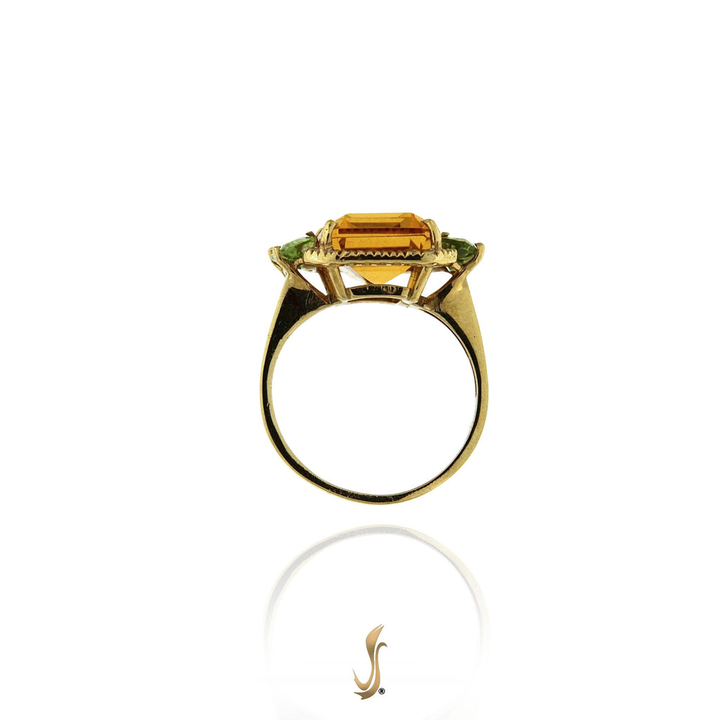 anello topazio idrotermale e peridoti con oro e diamanti
